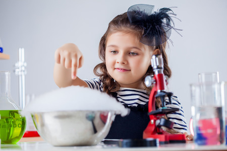 Cute naturalist conducting experiment in laboratoryの写真素材