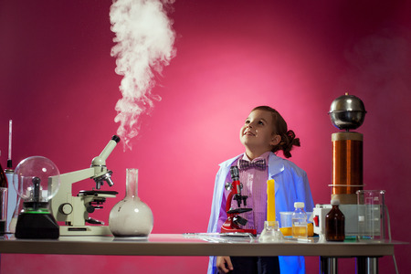 Joyful girl watching successful progress of experiment, close-upの写真素材