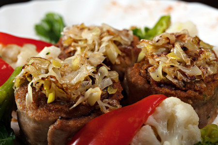 Appetizing meat rolls stuffed with vegetables, close-up