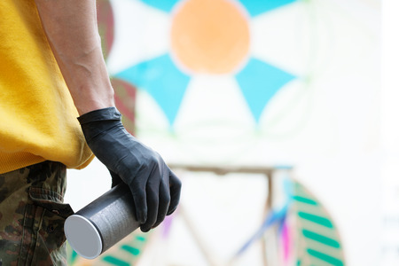 Image of graffiti artist\'s hand with spray can, close-upの写真素材