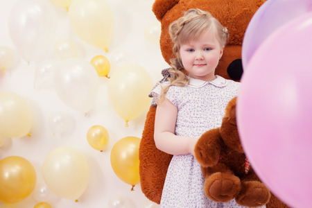 Image of pretty neat girl posing at camera in playroomの写真素材