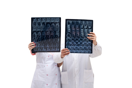 Image of doctors holding tomograms in front of themの写真素材