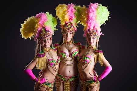 Studio shot of pretty carnival dancers posing at cameraの写真素材