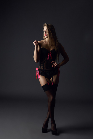 Studio photo of exciting model dressed in lace peignoirの写真素材