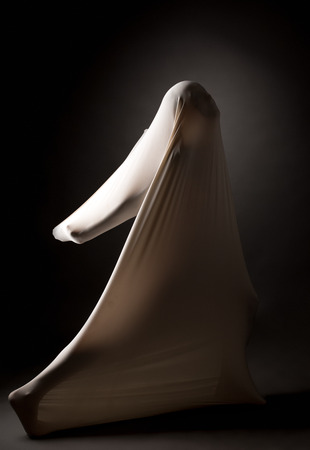 Infighting concept. Girl tries to break through her cocoonの写真素材