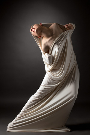 Concept. Image of beautiful naked girl breaks her cocoonの写真素材