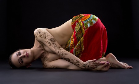 Yoga. Photo of beautiful woman with mehndi patternsの写真素材