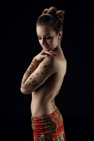 Mehndi. On woman's hands and back patterns of hennaの写真素材