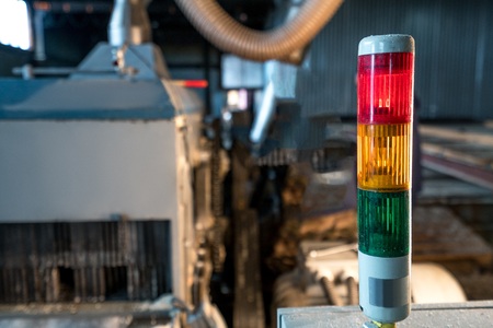 Image of tri-color LED on machine at sawmill, close-upの写真素材