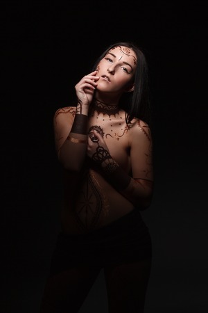 Mehendi. Image of sensual young woman with henna bodyartの写真素材