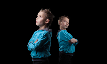 Image of nice little twins isolated on black backgroundの写真素材