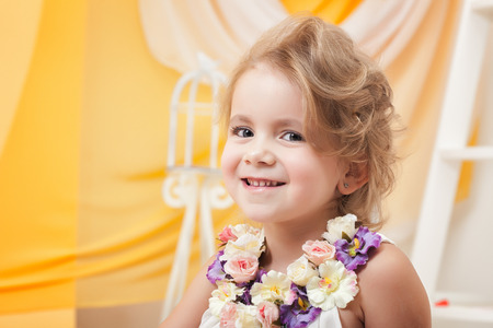 Portrait of cute little girl smiling at camera, close-upの写真素材