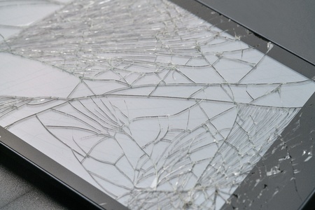 Photo of smartphone with fractured screenの写真素材