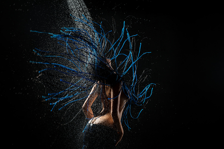 Blue dreadlocks topless girl rearview in showerの写真素材