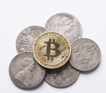 Golden bitcoin on Russian old coins close up shotの写真素材