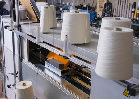 Spools with thread at knitting shop viewの写真素材