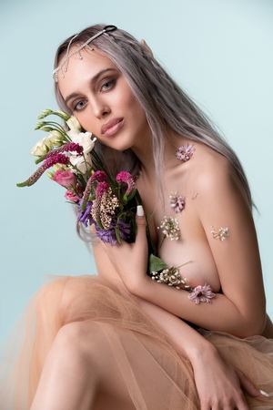 Gorgeous sexy girl-elf with flowers portraitの写真素材