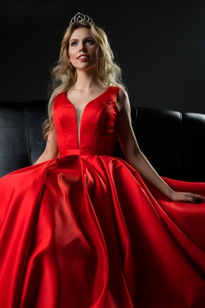 Queen of beauty in red luxurious dress shotの写真素材