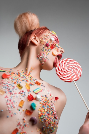 Woman topless with caramel on her face shotの写真素材