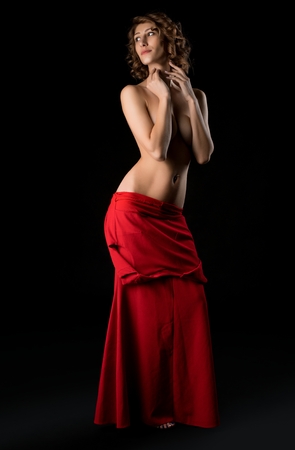 Blonde topless against black background shotの写真素材