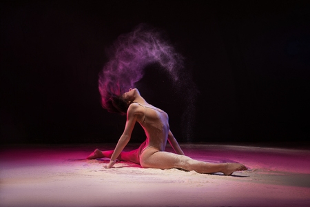 Professional dancer waving with hair in powderの写真素材