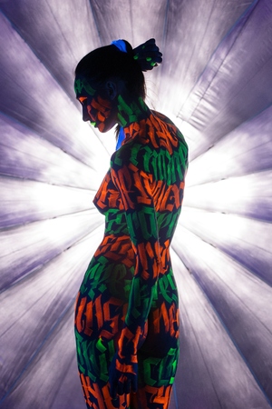 Girl with UV bodyart rearviewの写真素材