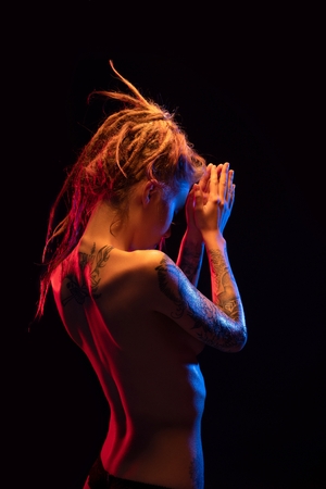 Girl with henna bodyart and dreadlocks rearviewの写真素材