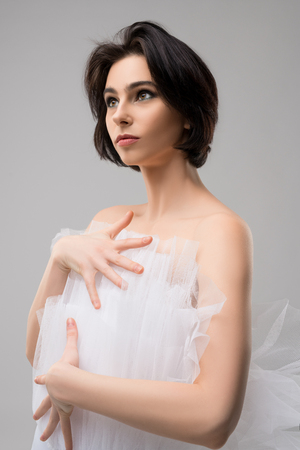 Beautiful brunette in ballet tutu portraitの写真素材