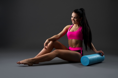 Beautiful brunette in pink sportswear shotの写真素材