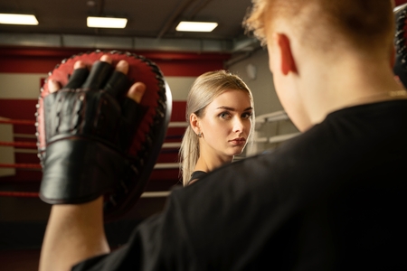 Young couple in boxing ring close up shotの写真素材