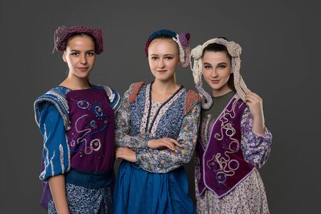 Teenaged girls in original costumes and hatsの写真素材