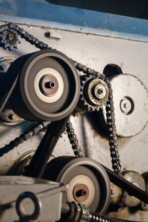 At sawmill. Image of rotating gears on running machine