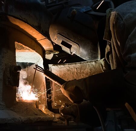 Industry. Photo of professional welder at work