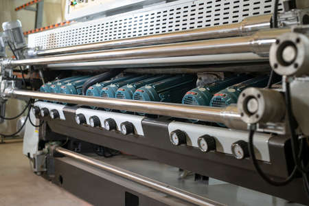 Glass polishing machine at modern industrial factoryの写真素材
