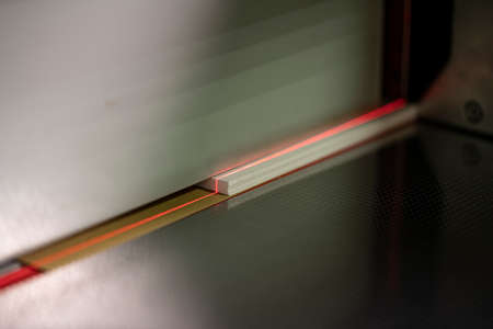 laser line on paper of cutting machine