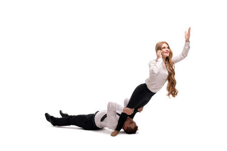 Teamwork concept businessman supporting woman during phone conversation