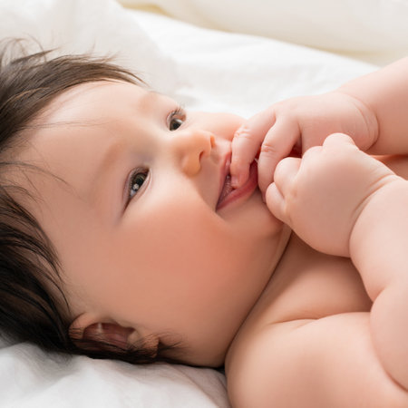 Little baby boy in bed viewの写真素材