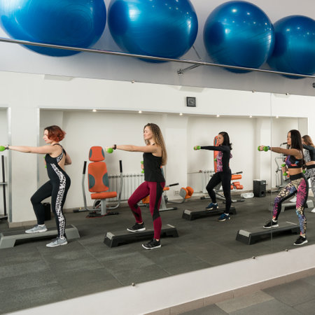 Young women exercising in a gym view