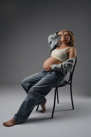 Pregnant Woman Sitting on Chairの写真素材