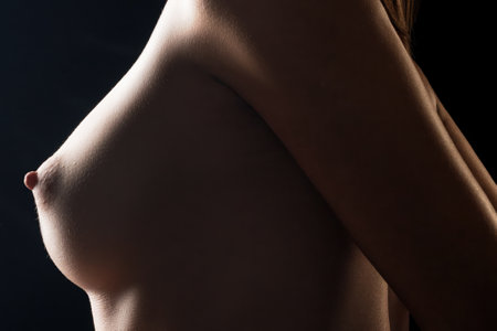 Nude girl on her knees tied up with rope shotの写真素材