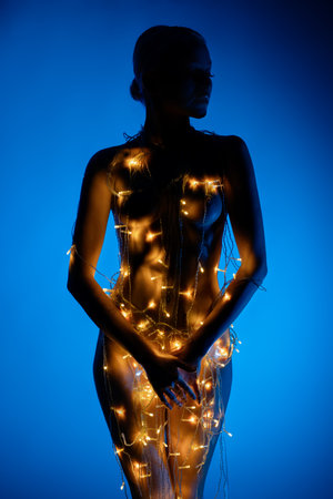 Beauty of light and form in a striking silhouette of a womanの写真素材