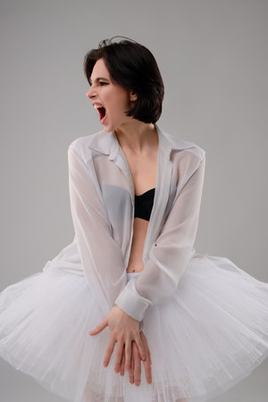 Dance of femininity in lingerie and ballet wear in a studio settingの写真素材