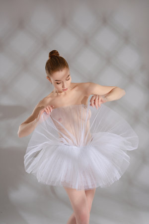 Beauty and grace of a ballet dancer captured in delicate movementの写真素材