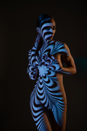 Projector light casts artistic shadows in abstract patternsの写真素材