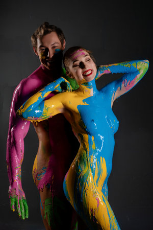 Colorful body painting performance with models showcasing vibrant designsの写真素材