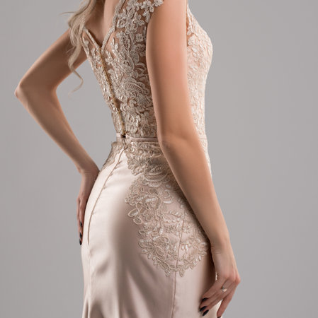 Elegant gown showcasing delicate lace detailing at a fashion eventの写真素材