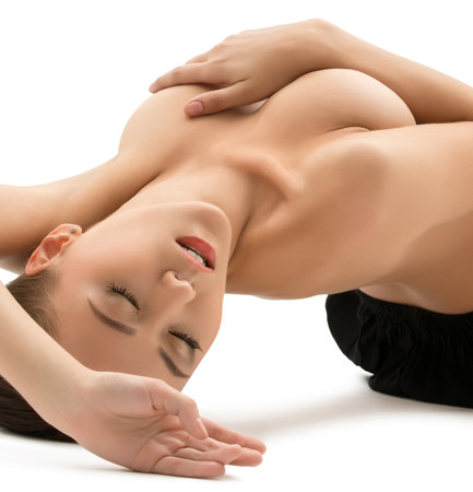 Topless woman lying posing at cameraの写真素材