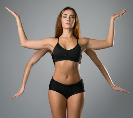 Slim girls formed figure with four handsの写真素材