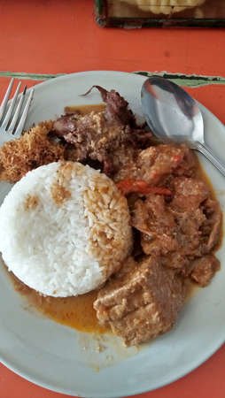 delicious indonesian traditional food rice and spicy meatの写真素材