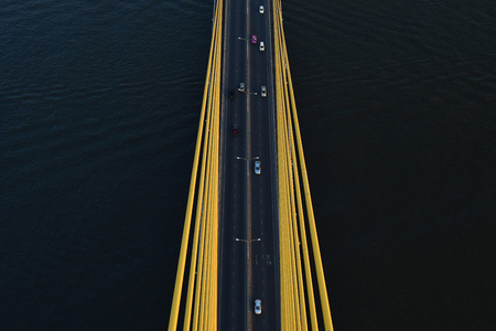 Aerial view Road, The expressway across the river has many cars in Thailand. Beautiful Street , Top view Backgroundの写真素材